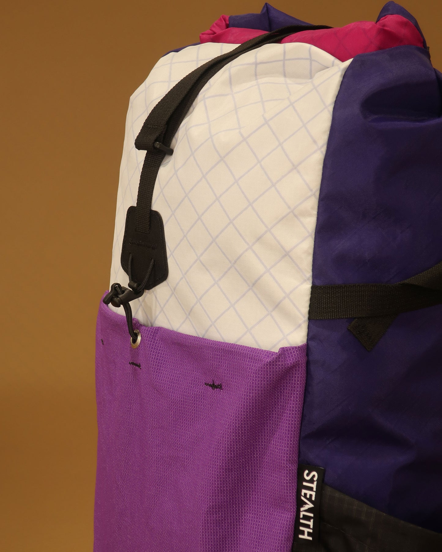 Rata 25 daypack pocket detail in white purple and fuchsia showing ultrastretch fabric made by Stealth Wellington NZ