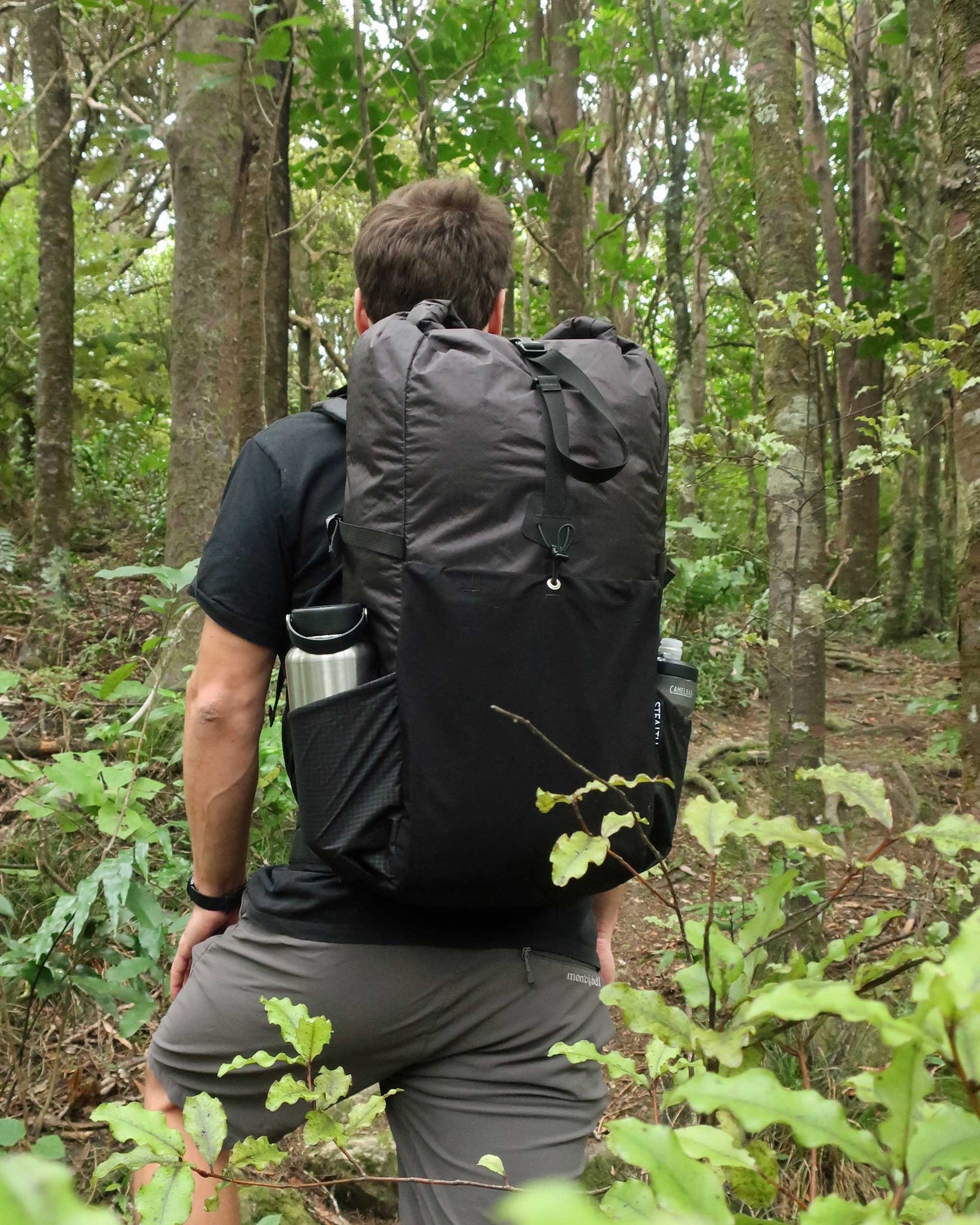Rata 40 lightweight multiday pack on trail in NZ native bush showing pack fit and shoulder straps, made by Stealth Wellington NZ
