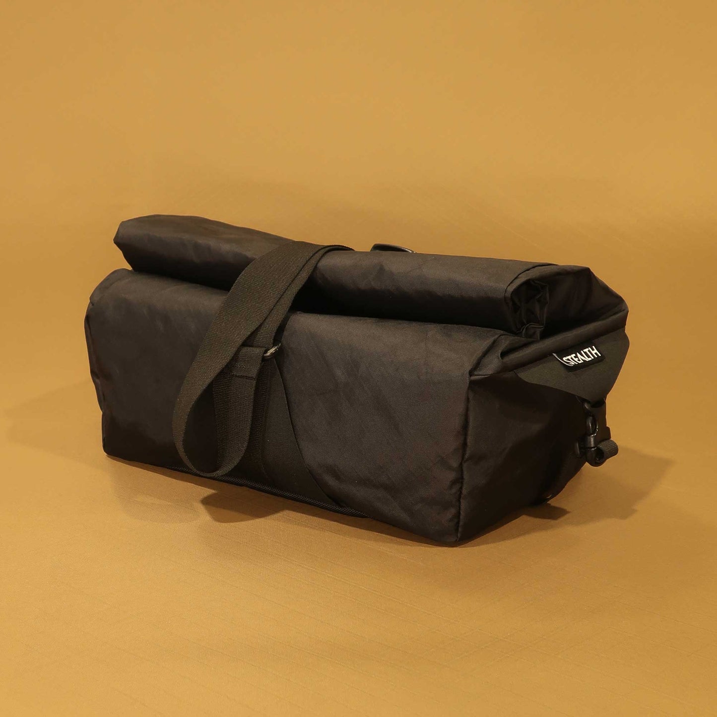137 Carryall back view in black EPX200 showing roll closure and carry strap made by Stealth Wellington NZ