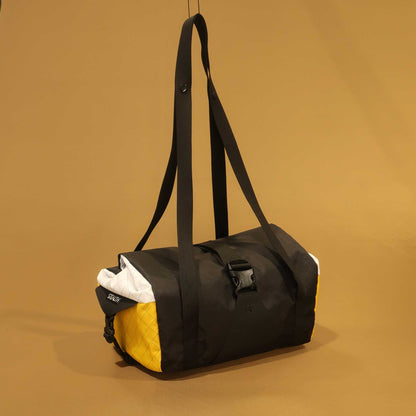 Bikepacking basket bag in black yellow and white multicolour with  carry straps made by Stealth Wellington NZ