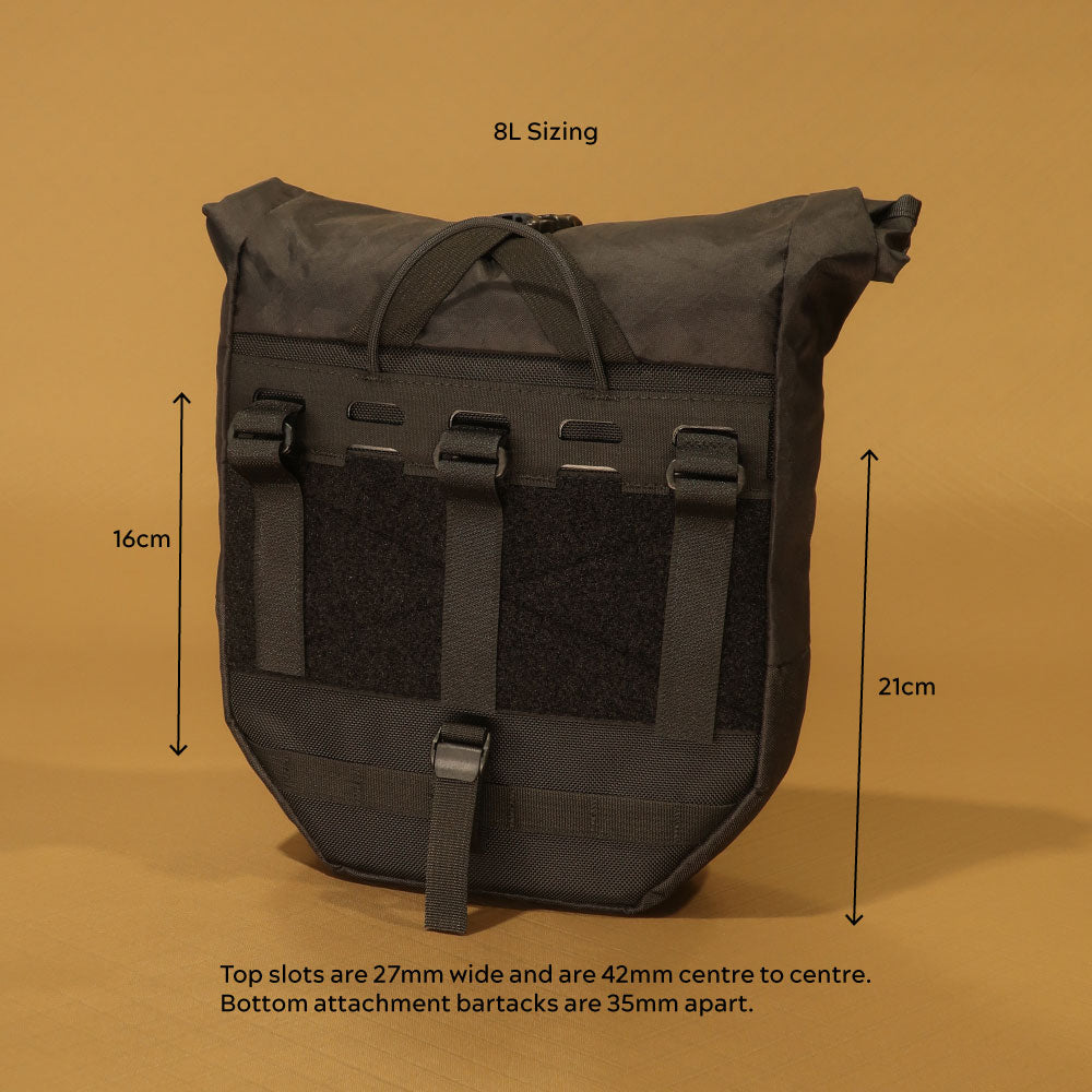 Rear view of 8L pannier with attachment dimensions labelled: 16cm upper strap zone, 21cm lower panel height, 27mm wide top slots spaced 42mm centre to centre, and 35mm bottom bartack spacing