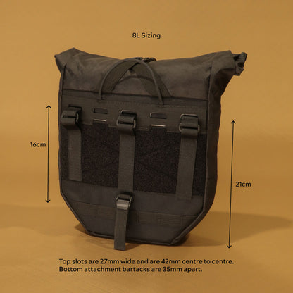Rear view of 8L pannier with attachment dimensions labelled: 16cm upper strap zone, 21cm lower panel height, 27mm wide top slots spaced 42mm centre to centre, and 35mm bottom bartack spacing