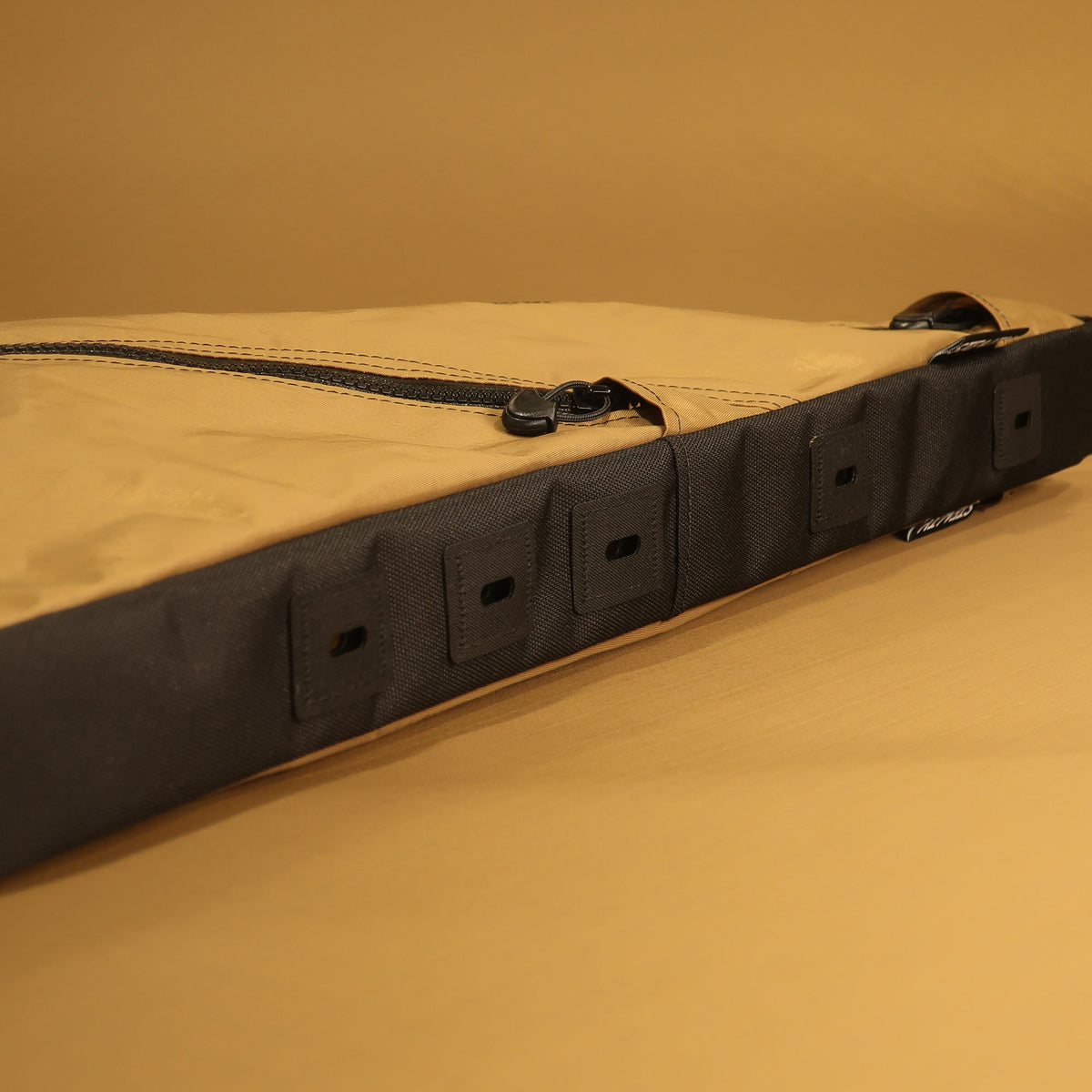 Custom full frame bike bag in Coyote fabric with dual zippers and full bolt-on attachment, designed for Auren Bikes, ideal for carrying gear on cycling adventures.