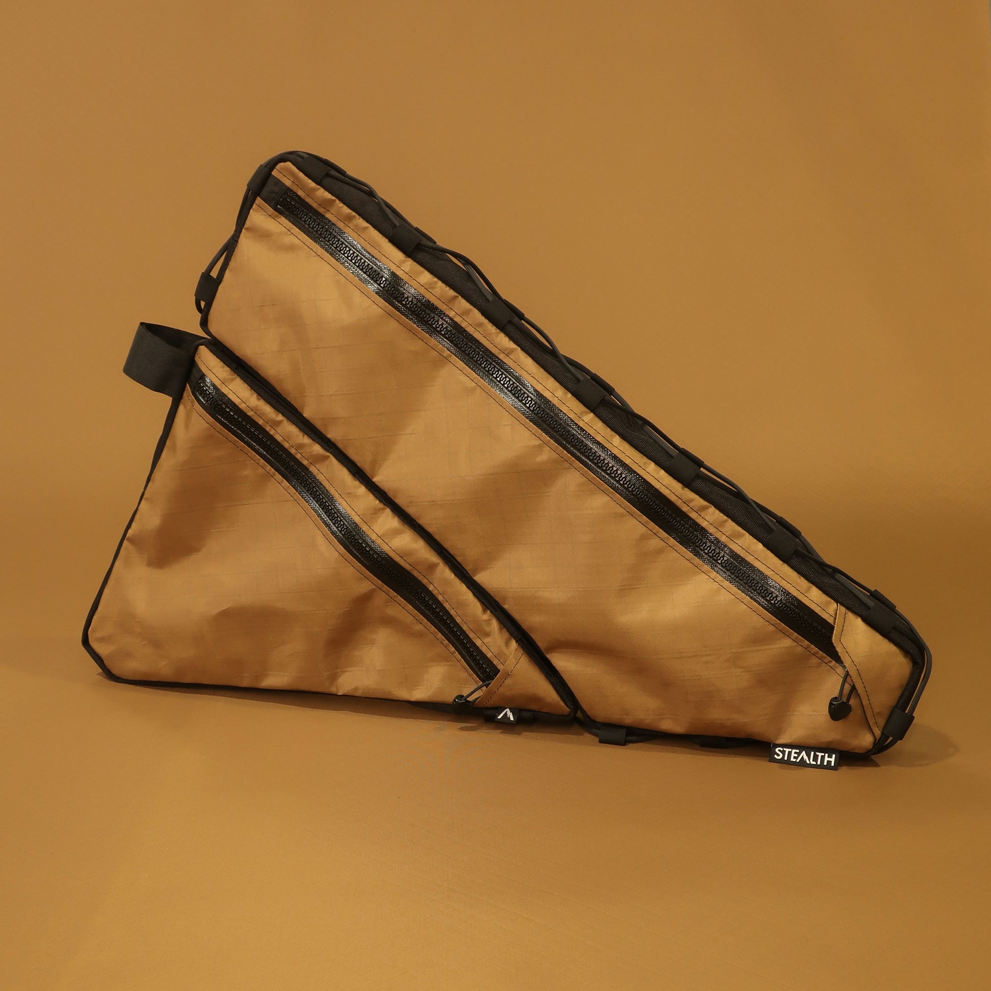 Custom split full frame bag in Coyote, showing both bags together, made for a Curve GMX adventure bike by Stealth Adventure Equipment.