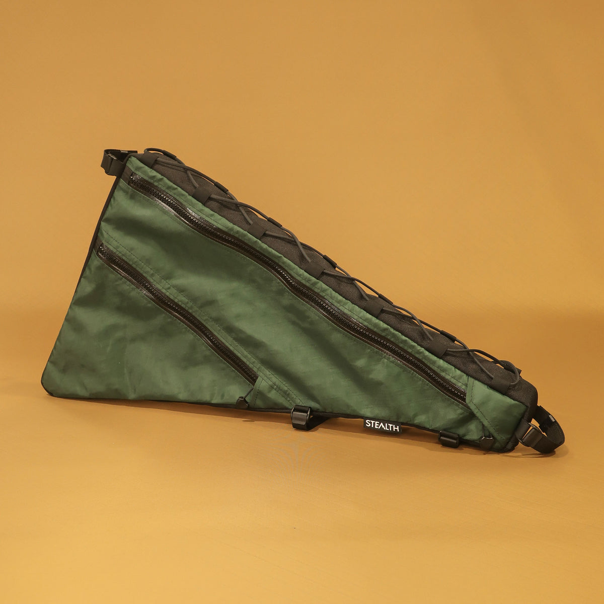 Custom green and black double zip full frame bag with multiple straps, designed for the Curve Uprock V2 bike, handmade in New Zealand for bikepacking.