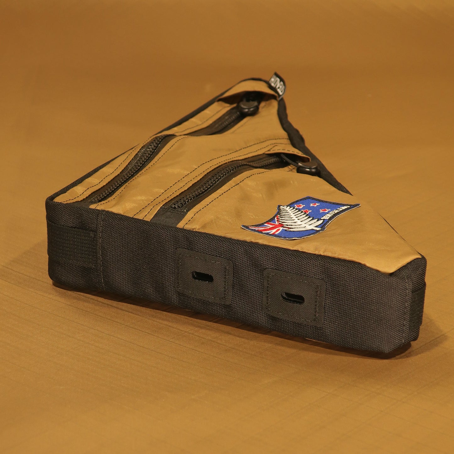 Custom Lynskey full frame bag in brown with two zippers and bolt-on attachment, handmade in New Zealand for bikepacking or cycling use.
