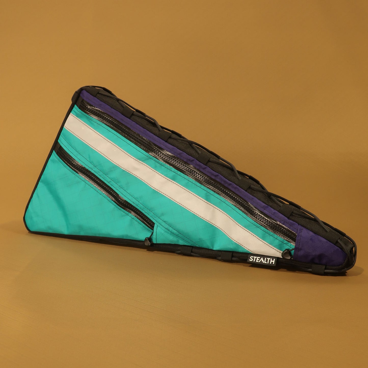 Custom double zip frame bag in teal purple and reflective with lace-up attachment made by Stealth Wellington NZ