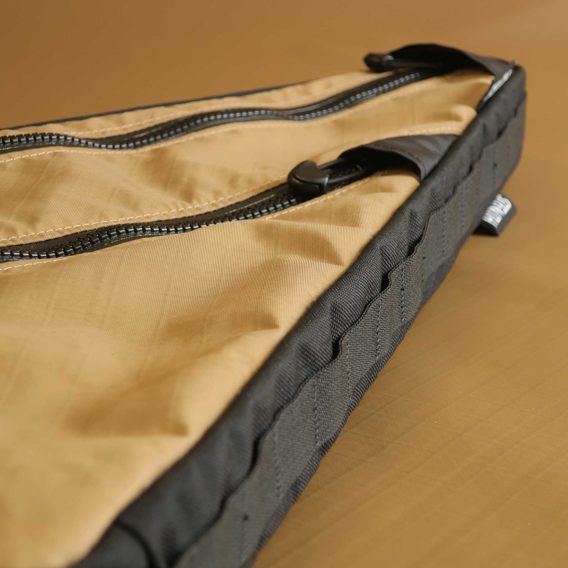 Custom frame bag close up showing daisy chain attachment system for bikepacking made by Stealth Wellington NZ