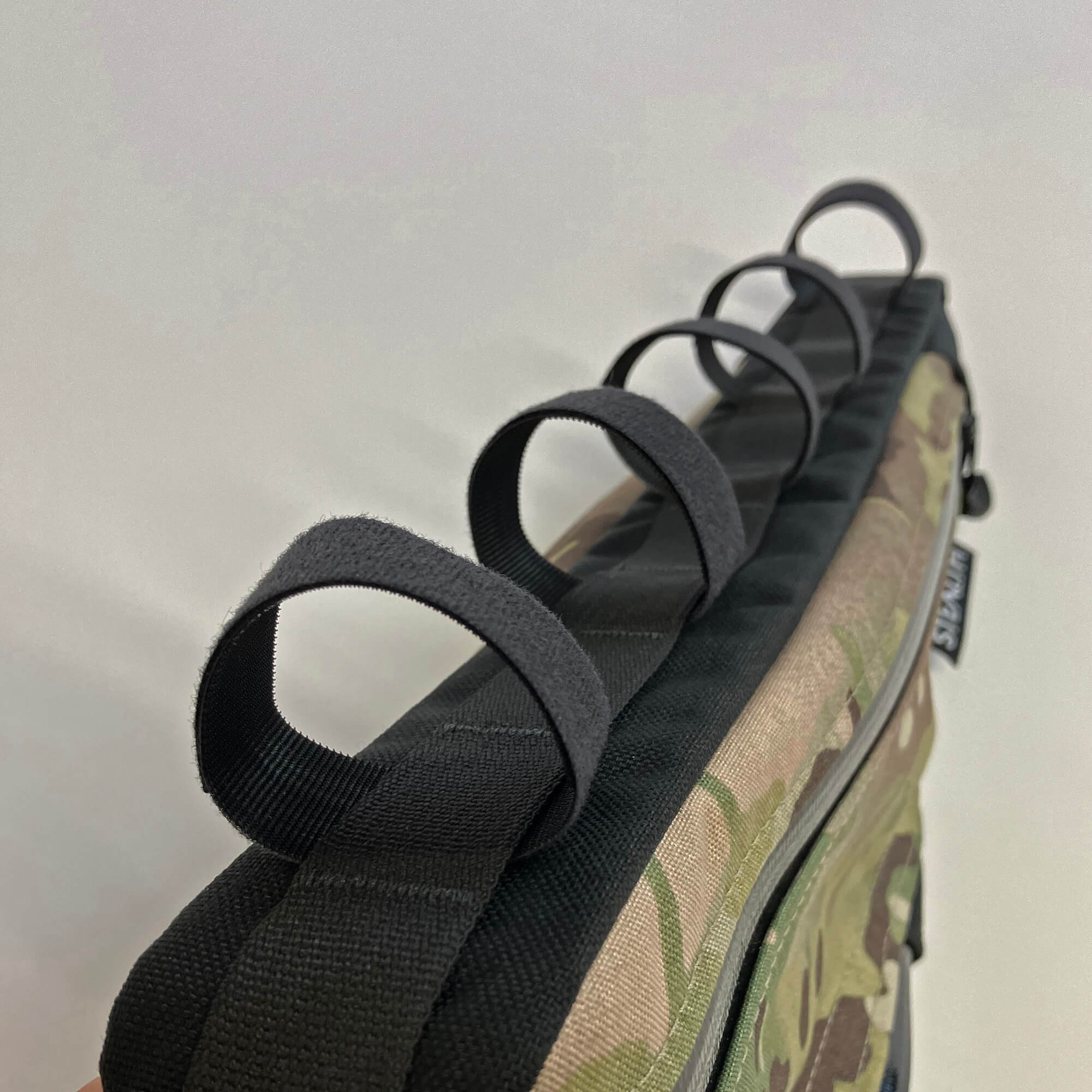 Daisy chain frame bag attachments