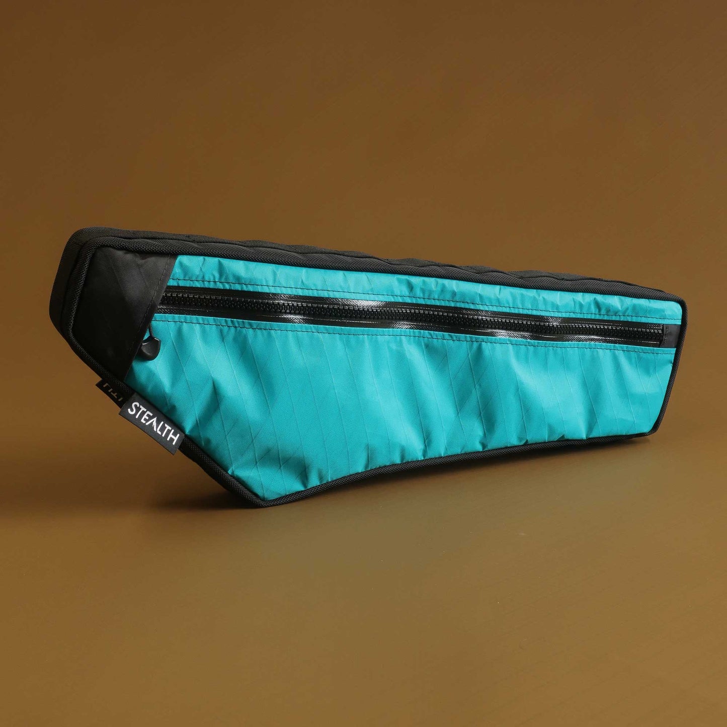 Bikepacking half frame bag in teal with water resistant zip and map pocket made by Stealth Wellington NZ