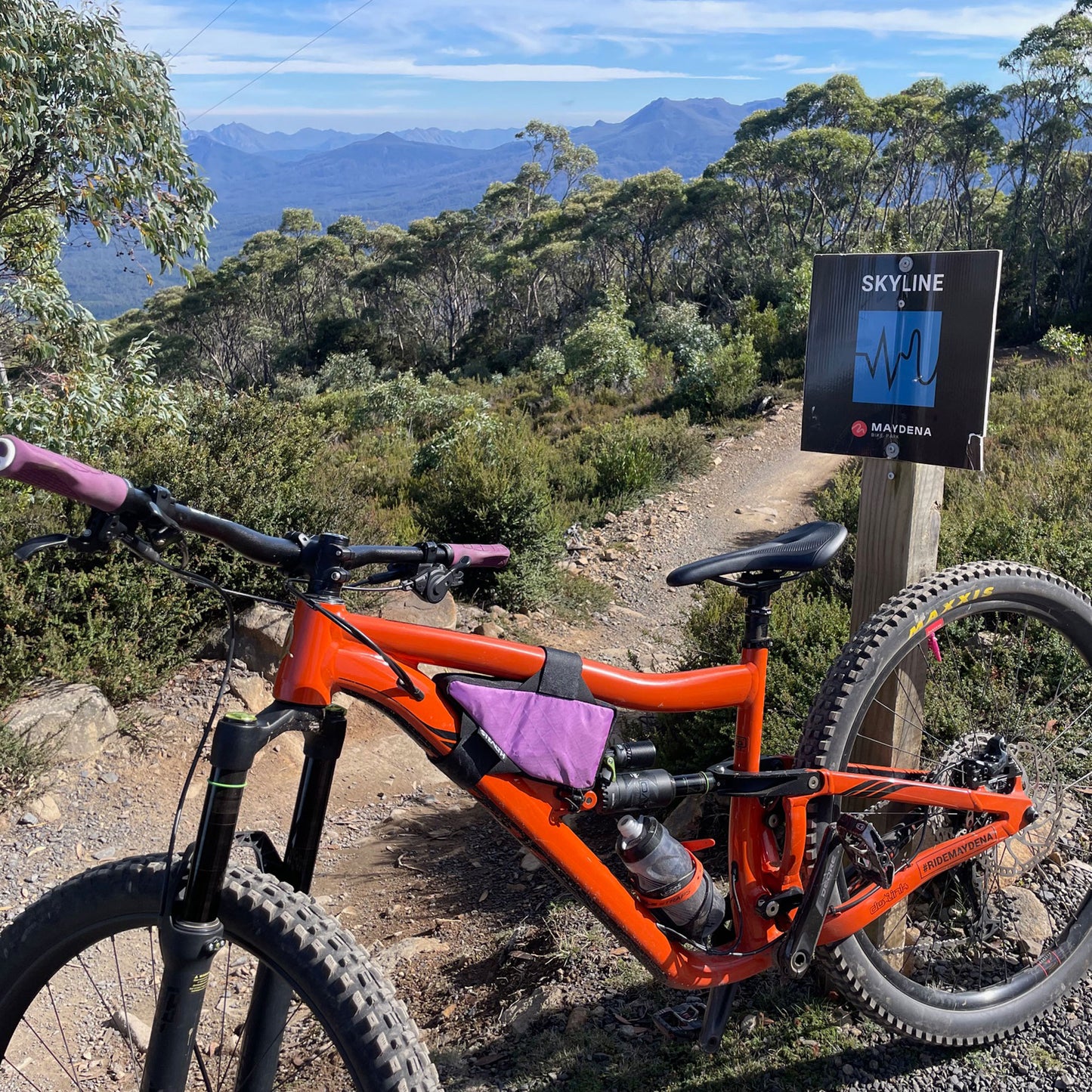 Ibis Ripmo custom mini wedge frame bag in lilac on orange full suspension at Maydena Bike Park made by Stealth Wellington NZ