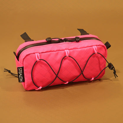 Limpet bumbag in pink flamingo EPX200 showing bungee front pocket and camlock handlebar straps made by Stealth Wellington NZ