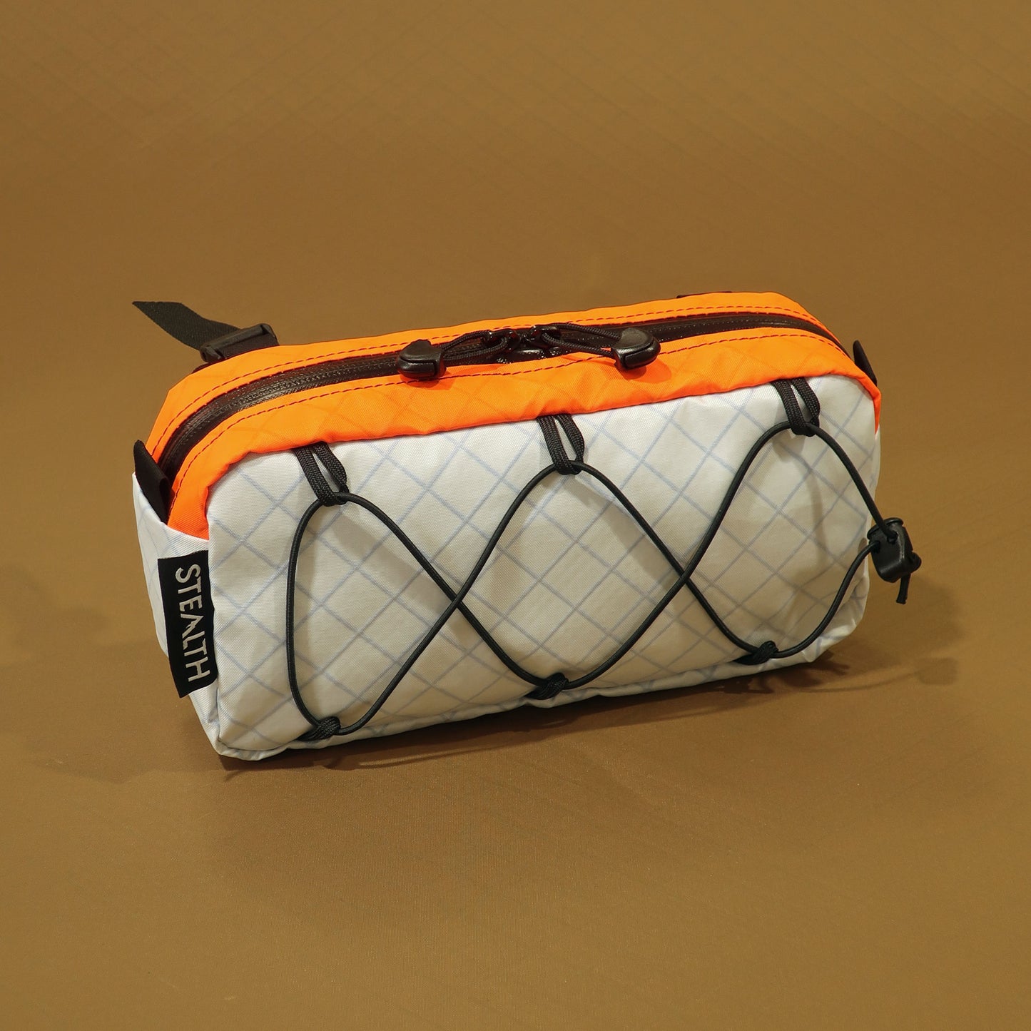 Limpet handlebar bag in snow white and blaze orange EPX200 with bungee front and camlock straps made by Stealth Wellington NZ
