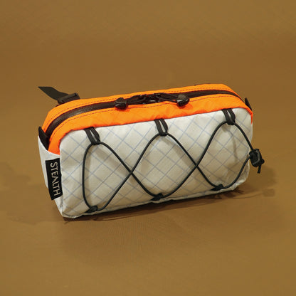 Limpet handlebar bag in snow white and blaze orange EPX200 with bungee front and camlock straps made by Stealth Wellington NZ