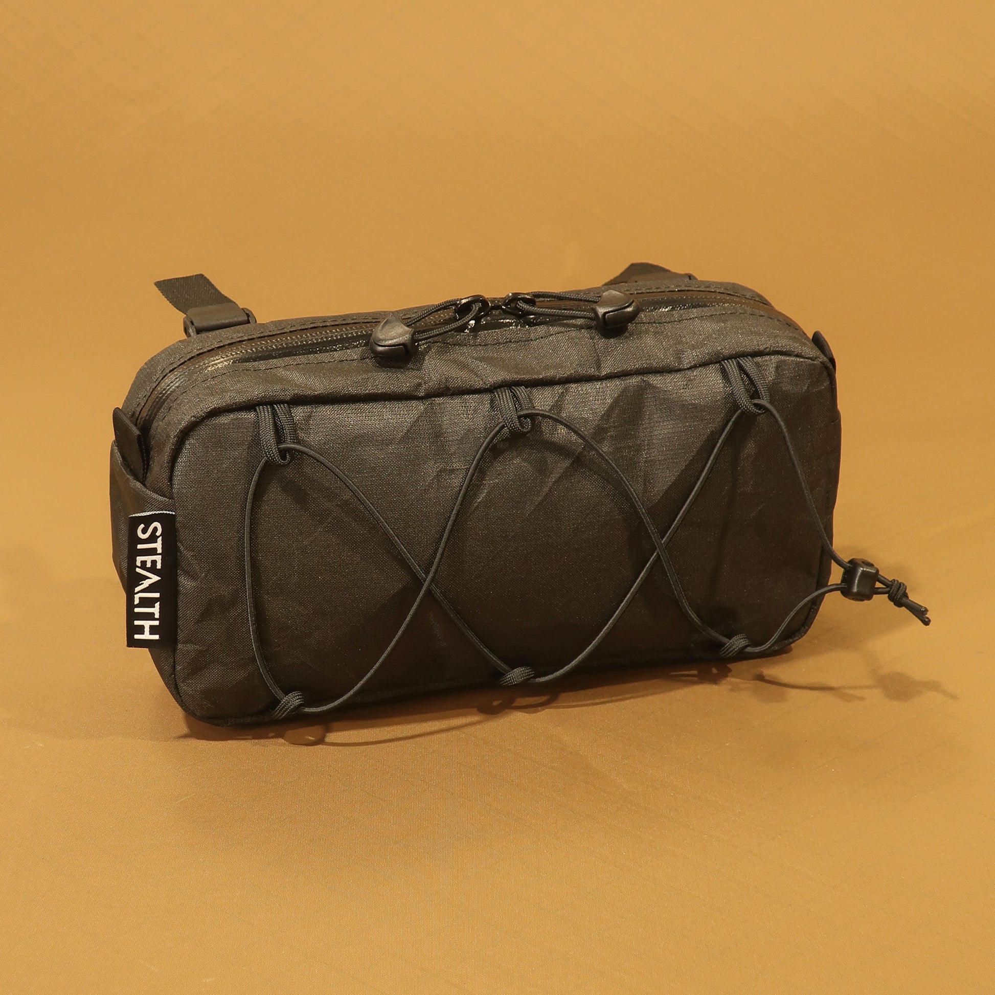 Limpet 2.5L bikepacking handlebar bag in black Ultra200x with bungee lashing and YKK zip made by Stealth Wellington NZ