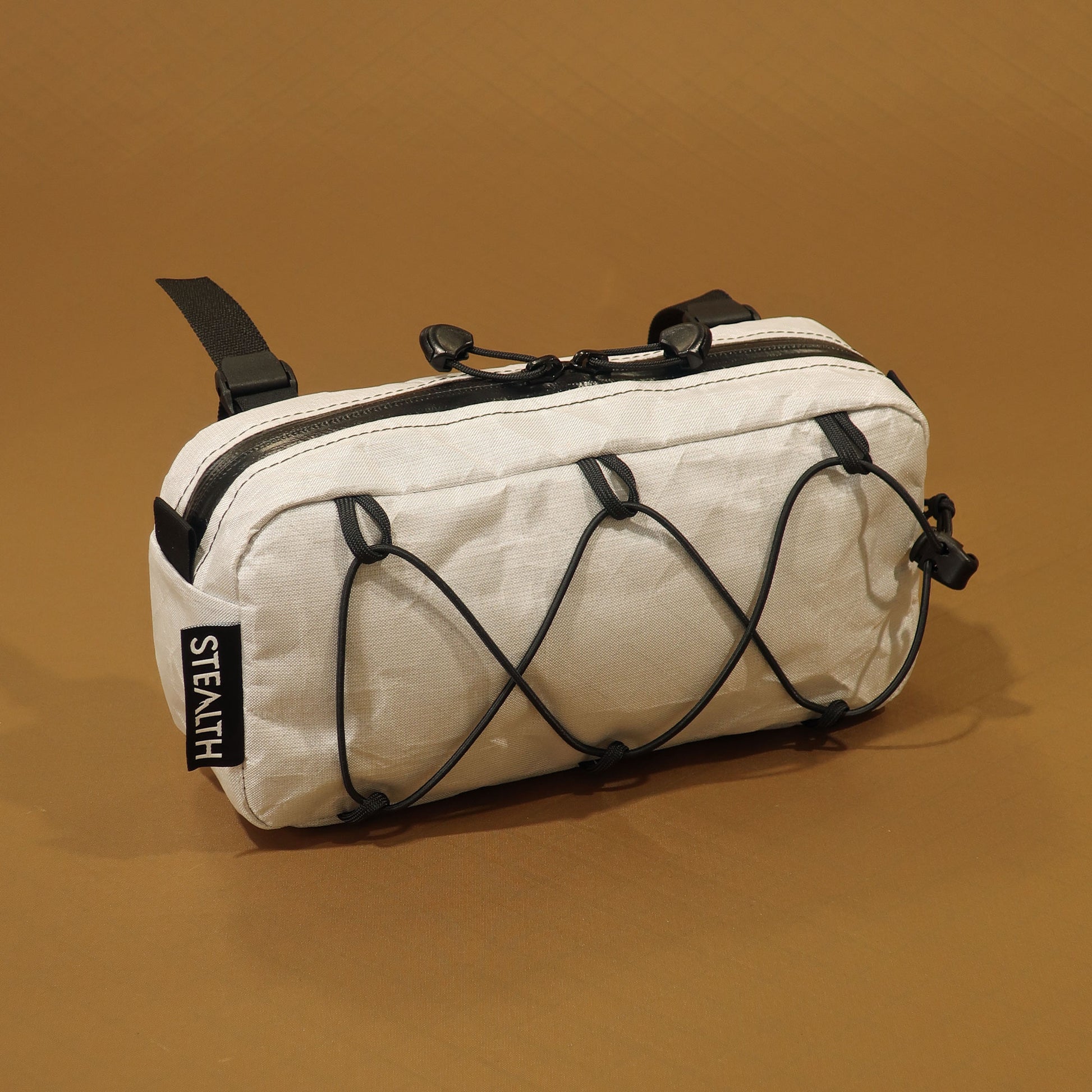 Limpet handlebar bumbag in white Ultra200x with bungee front pocket and camlock handlebar straps made by Stealth Wellington NZ