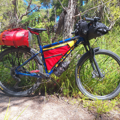 Marin Pine Mountain custom double zip frame bag in red and yellow on trail made by Stealth Wellington NZ
