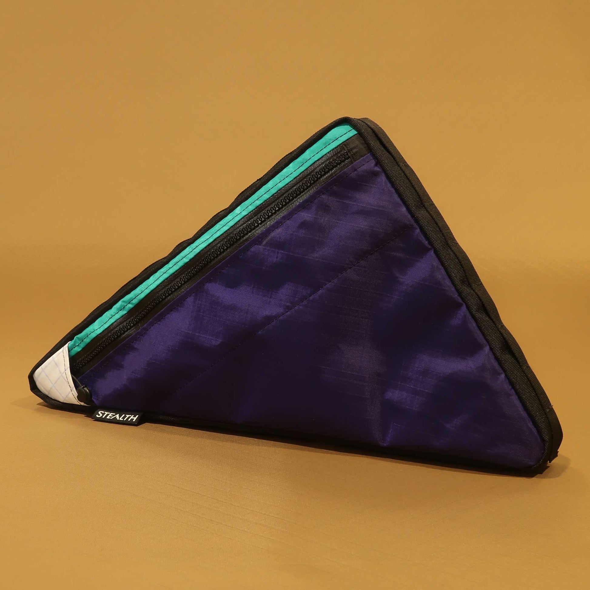 Custom gravel bike frame bag in purple with teal accents and map and phone pocket made by Stealth Wellington NZ