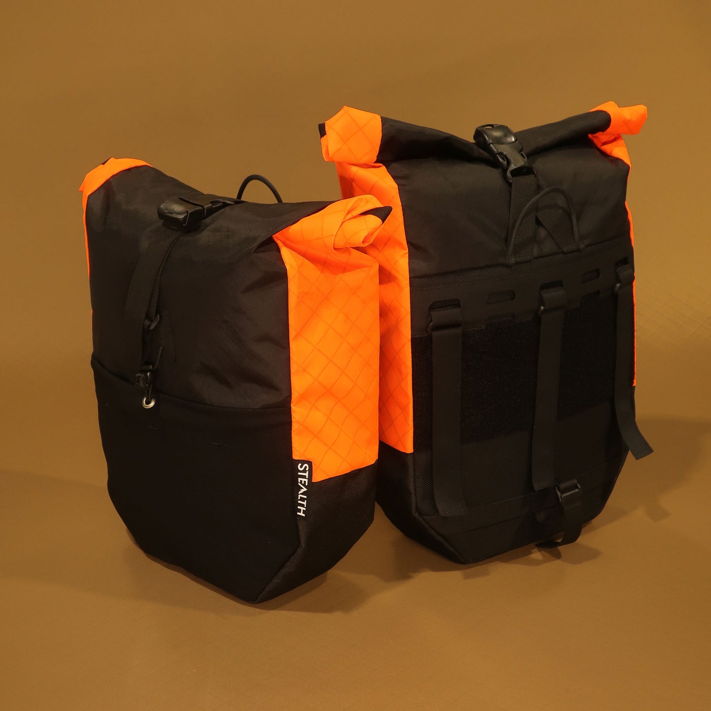 Bikepacking pannier pair in black and blaze orange EPX200 front and back view made by Stealth Wellington NZ
