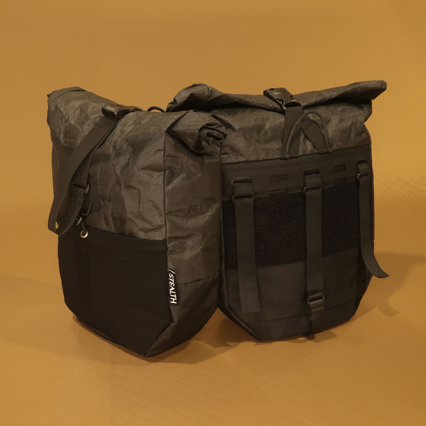 Mountain Pannier 10L pair in Ultra200 black showing front and velcro attachment back panel made by Stealth Wellington NZ