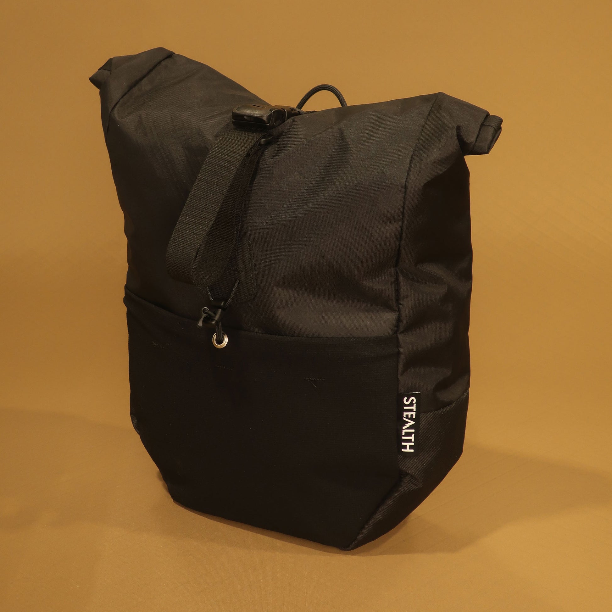 Mountain Pannier V2 10L in black with roll top and Ultra stretch front pocket made by Stealth Wellington NZ