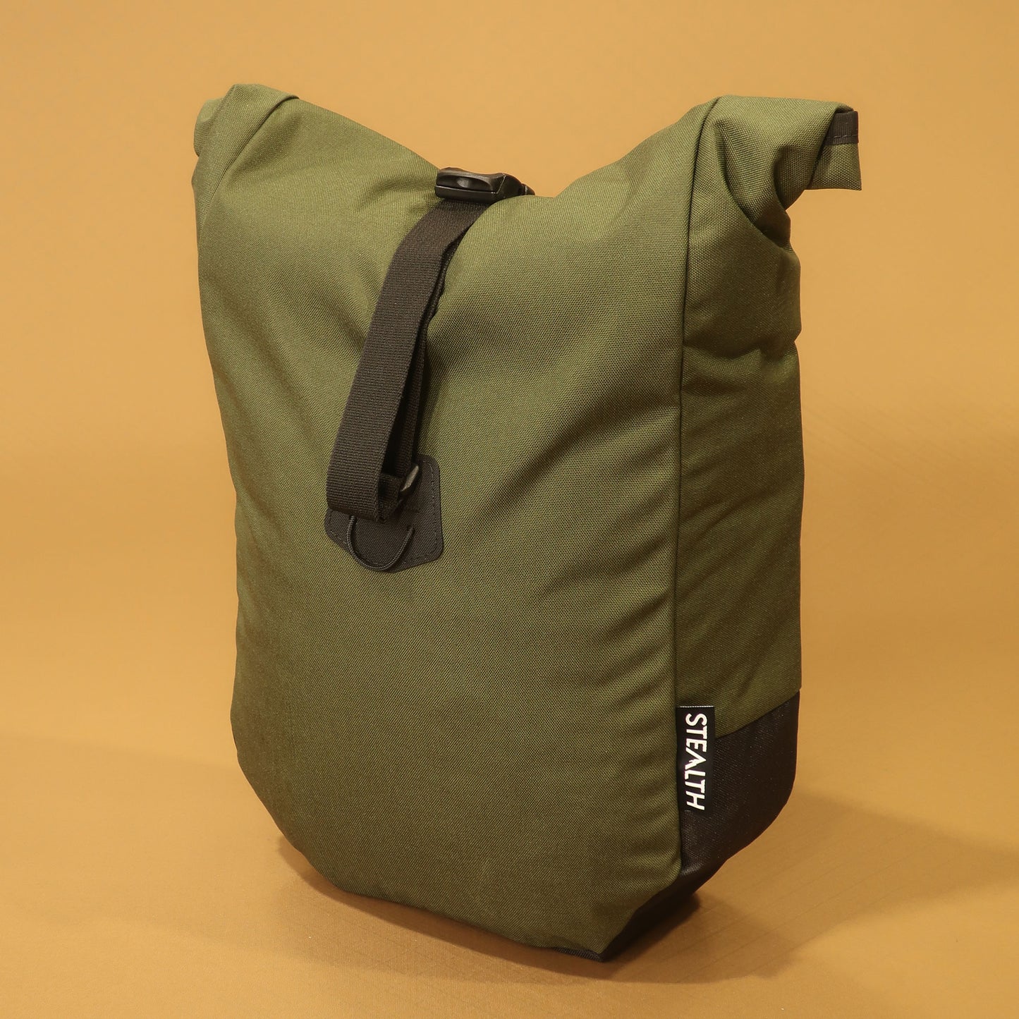 Olive Cordura mountain bike pannier with a roll top closure and adjustable attachment straps for bikepacking.