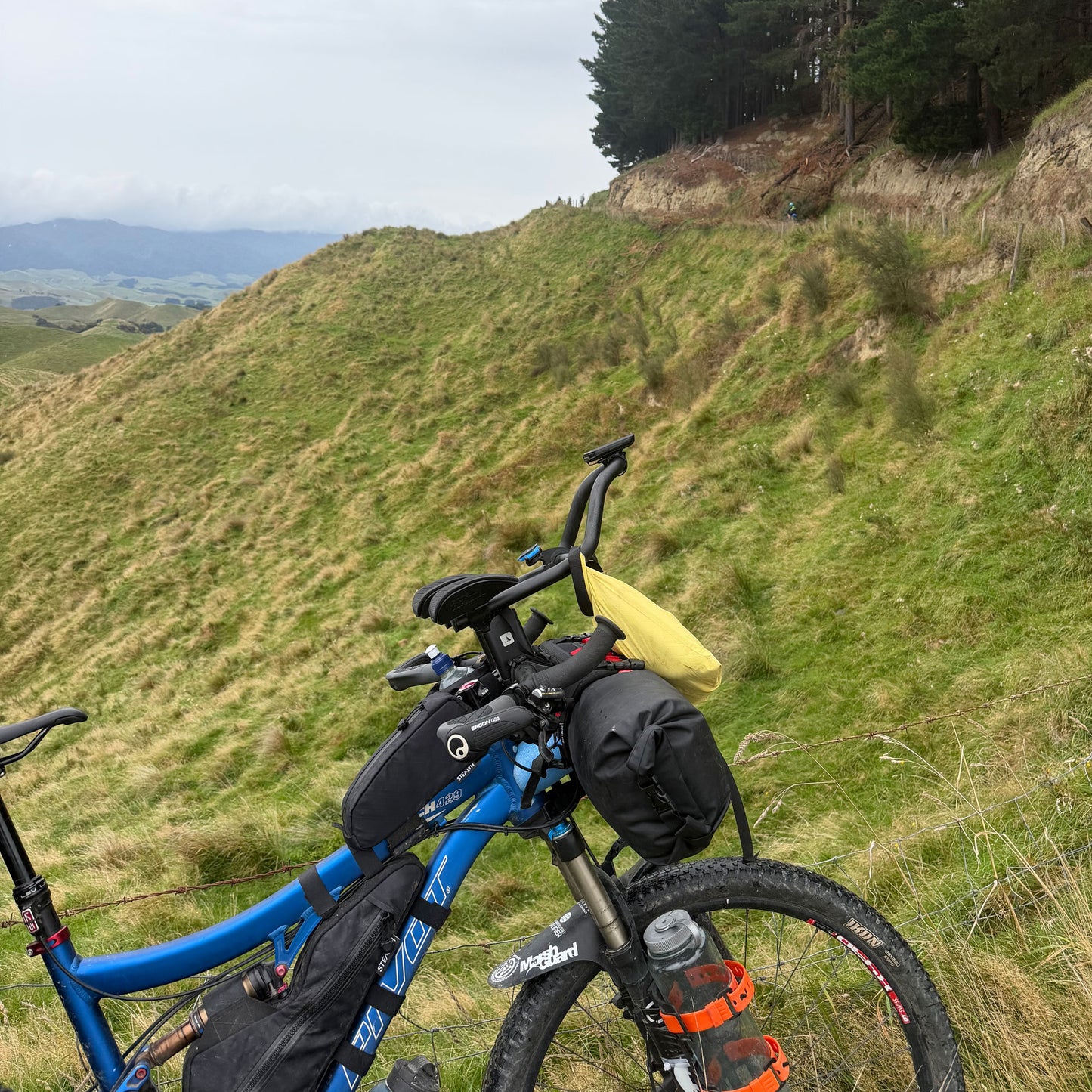 Pivot full suspension custom bikepacking frame bag in black fitted to compact frame on NZ trail made by Stealth Wellington NZ