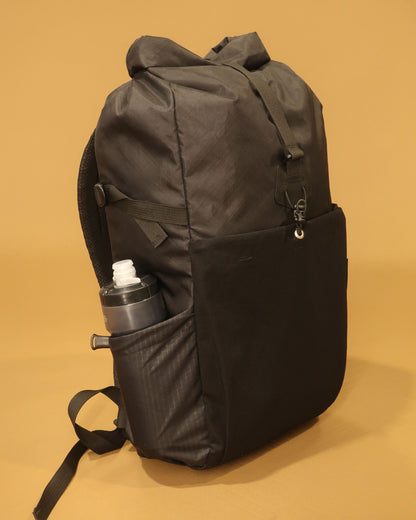 Rata 25 backpack side view showing 700ml bottle in ultragrid side pocket made by Stealth Wellington NZ