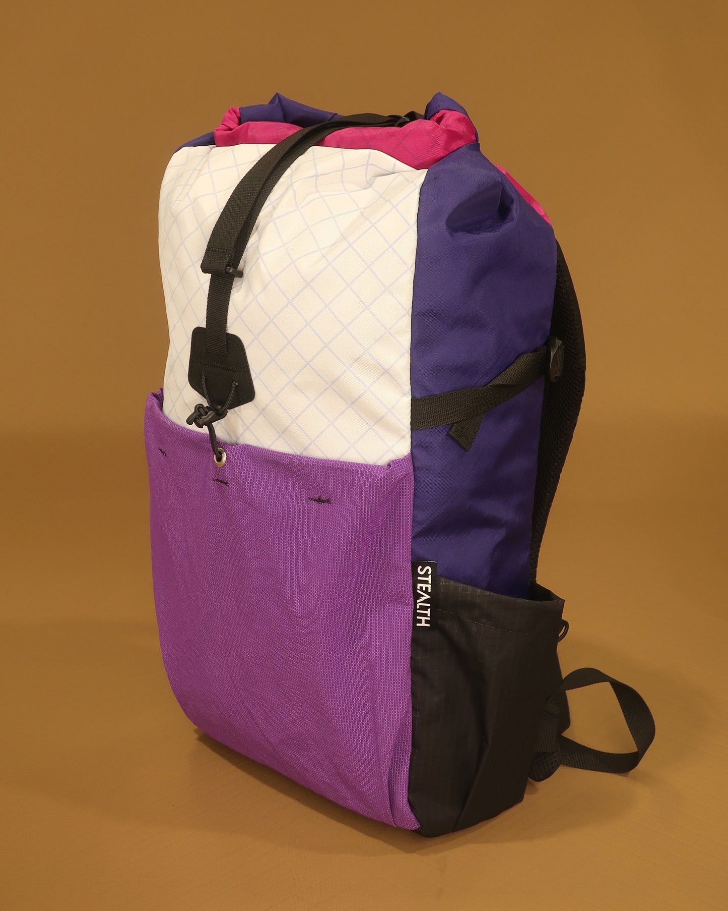 Rata 25 backpack in white purple and fuchsia showing ultrastretch front pocket made by Stealth Wellington NZ