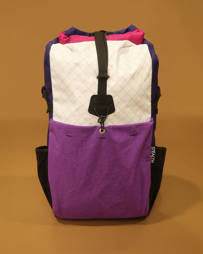 Rata 25 roll-top backpack in white purple and fuchsia with ultrastretch front pocket made by Stealth Wellington NZ