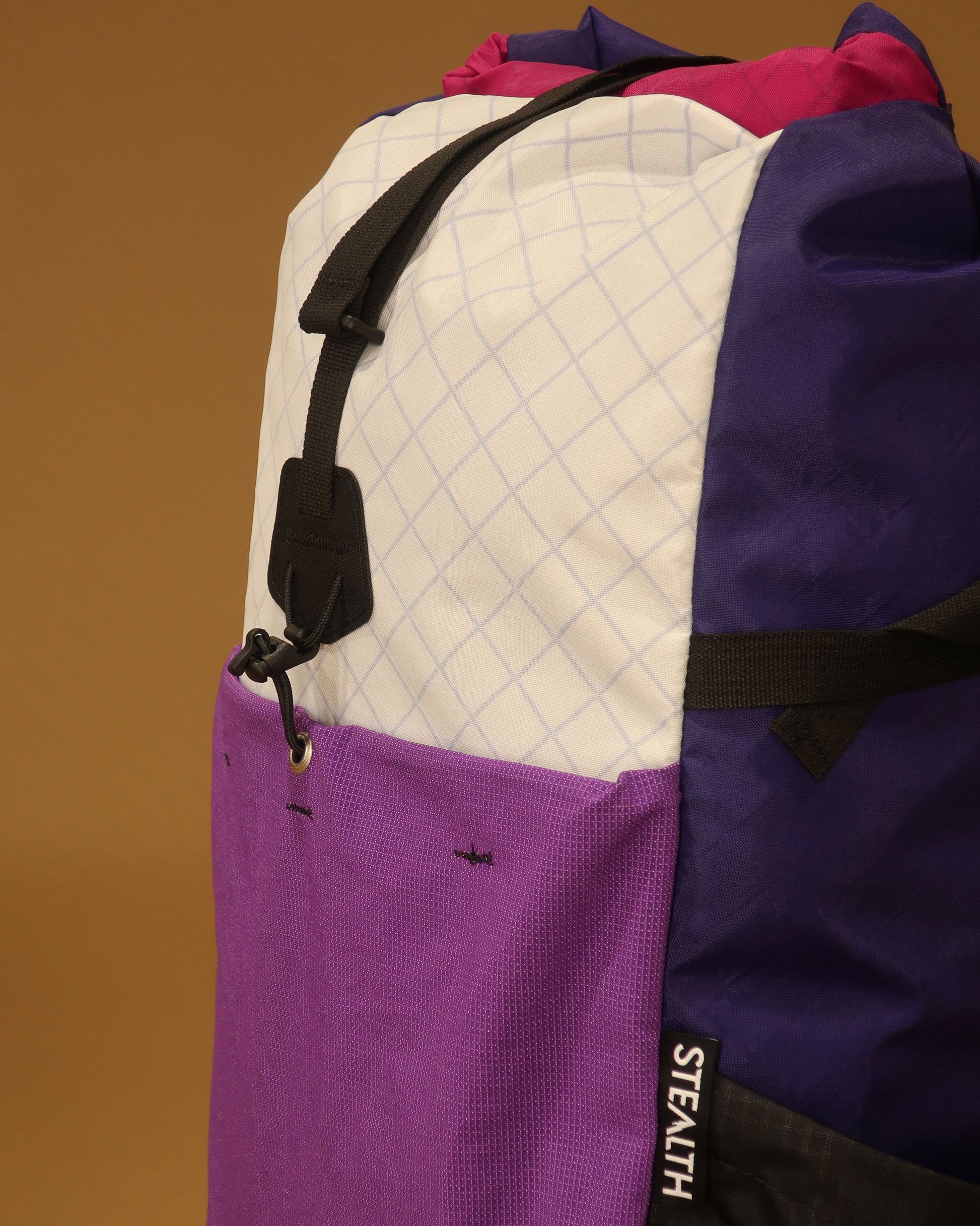 Rata 25 daypack pocket detail in white purple and fuchsia showing ultrastretch fabric made by Stealth Wellington NZ