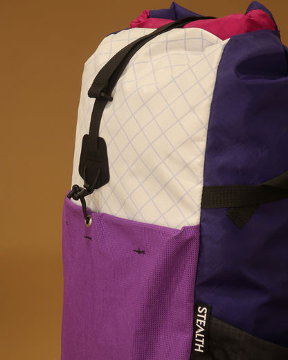 Rata 25 daypack pocket detail in white purple and fuchsia showing ultrastretch fabric made by Stealth Wellington NZ