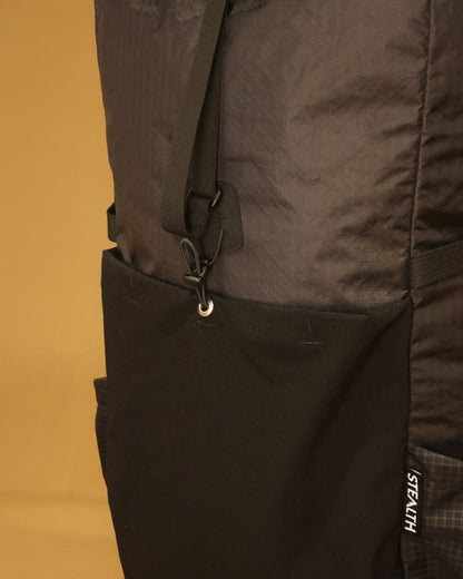 40L tramping pack ultra-stretch front pocket and compression strap detail in black, made by Stealth Wellington NZ
