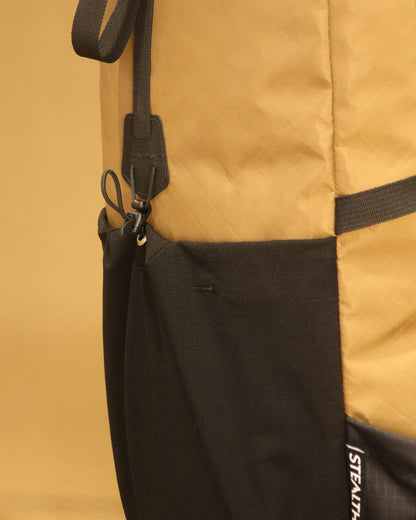 Tramping pack ultra-stretch front pocket showing bungee cord lock and hook detail, made by Stealth Wellington NZ