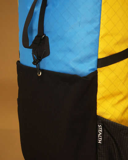 ramping pack ultra-stretch front pocket and compression strap hook detail, multicolour version, made by Stealth Wellington NZ