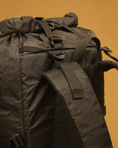 Rata 40 tramping pack shoulder strap detail showing load lifters and hydration tube port, made by Stealth Wellington NZ