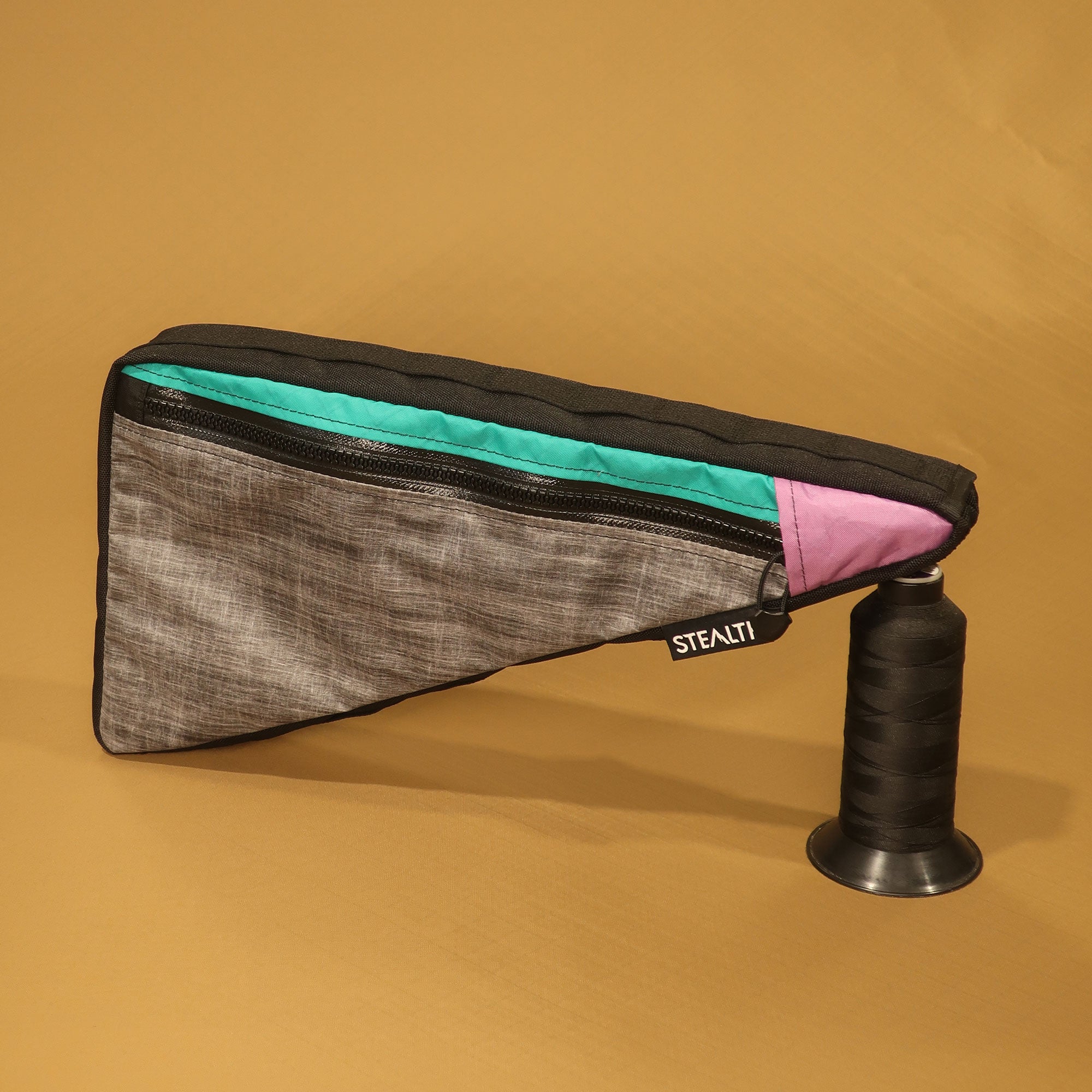 Custom handmade single-zip full frame bag in liteskin with teal and pink accents, designed for full-suspension Scott Spark 940