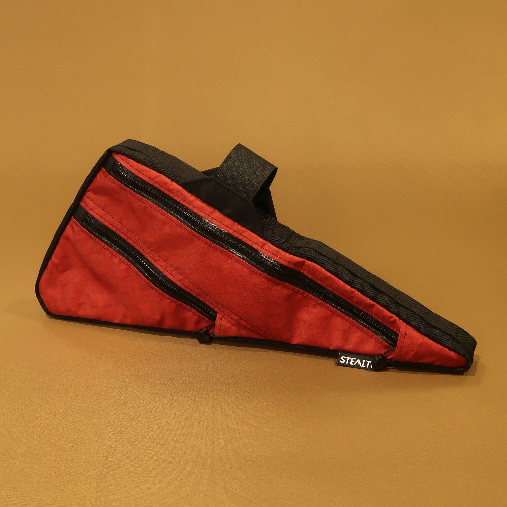 Red custom full frame bag with double zippers, black trim, and Velcro attachment, designed to fit Specialized Epic World Cup, handmade in New Zealand.