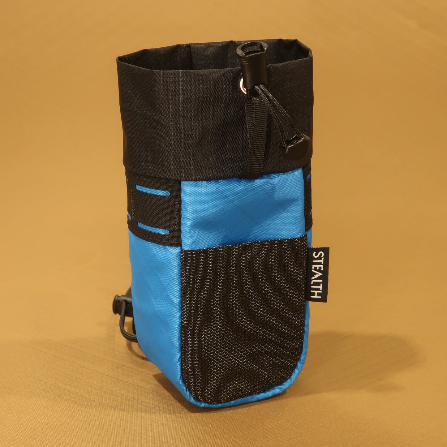 Stem Pouch V2 in bright blue with a black mesh front pocket and webbing attachment straps