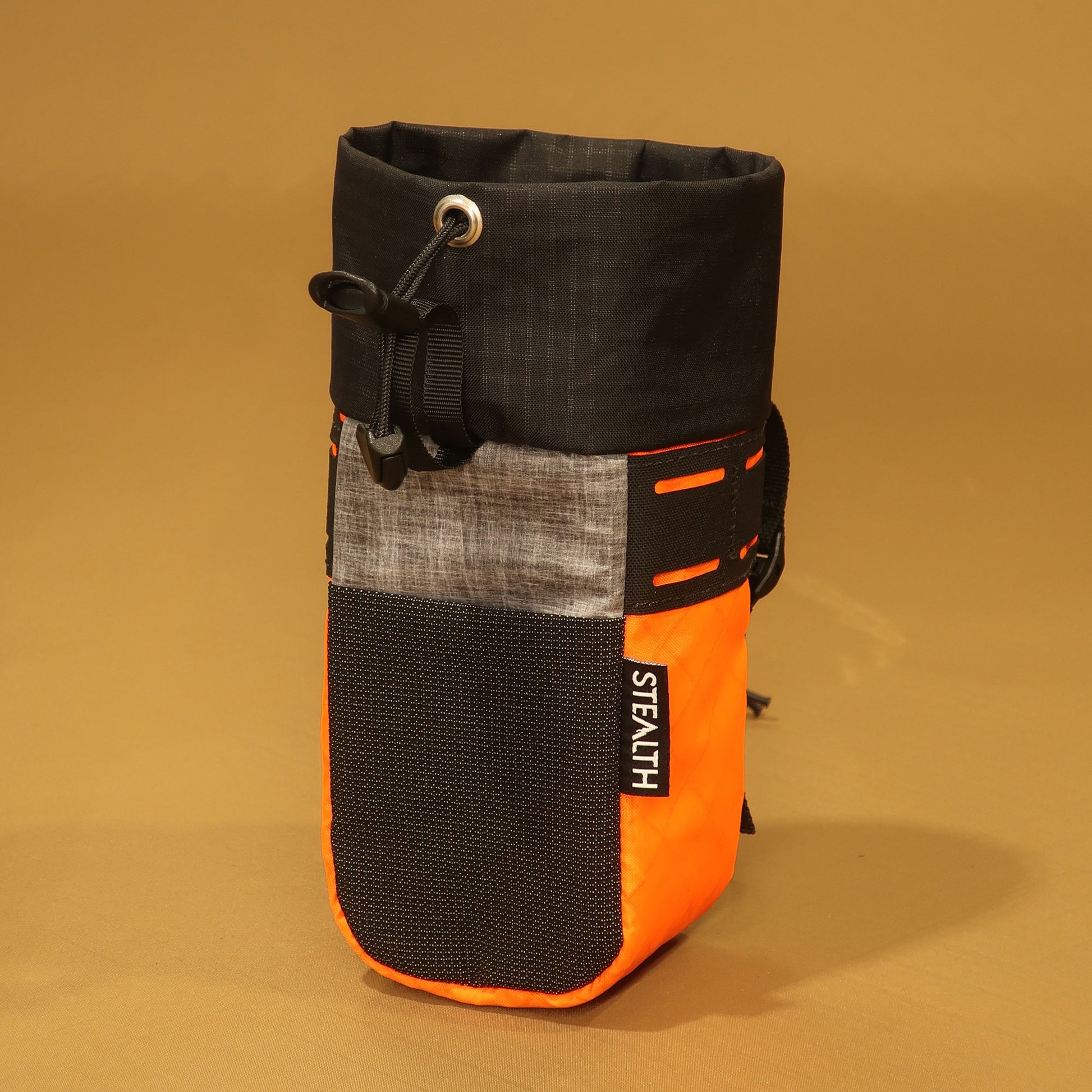 Stem Pouch bikepacking feed bag in bright orange and liteskin