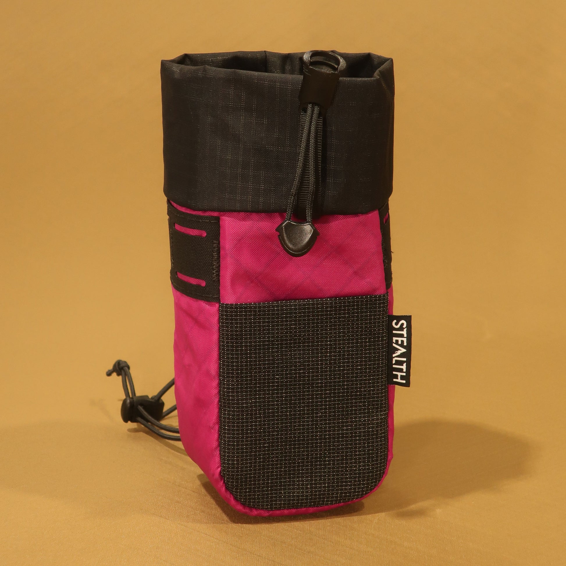 Stem Pouch V2 Fuchsia pouch with a black mesh front pocket and camlock attachment straps