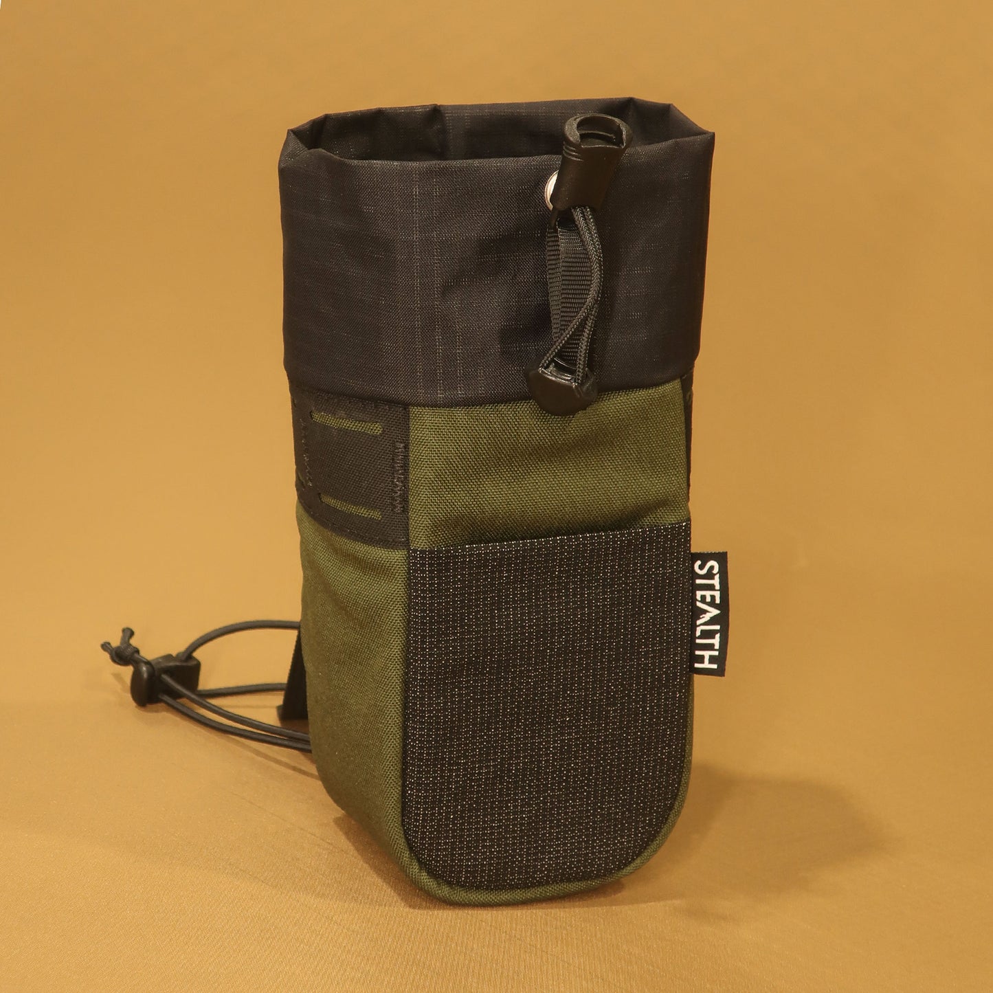 Stem Pouch V2 Olive pouch with an Ultra Stretch front pocket and laser-cut attachment points.