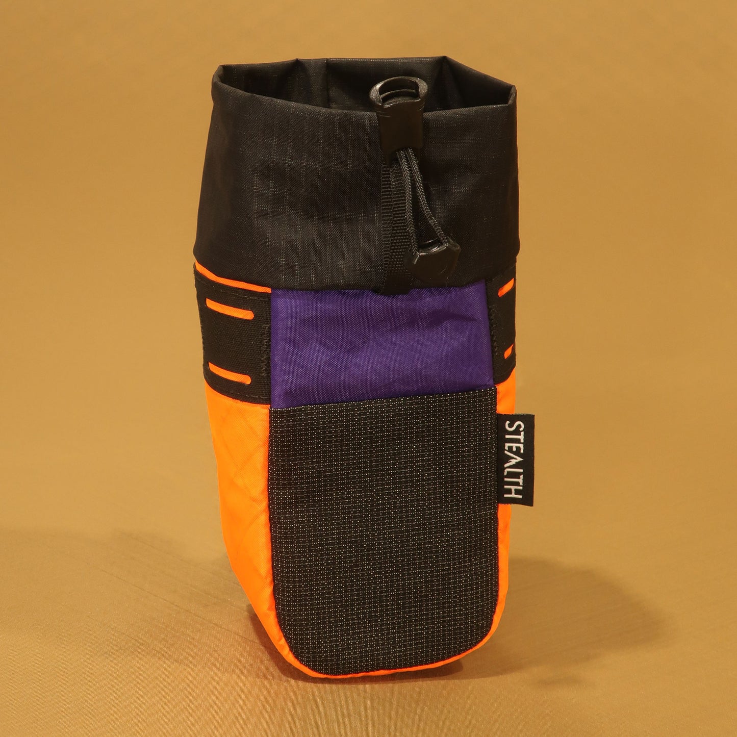 Stem Pouch V2 orange and purple pouch with a black mesh front pocket and attachment strap