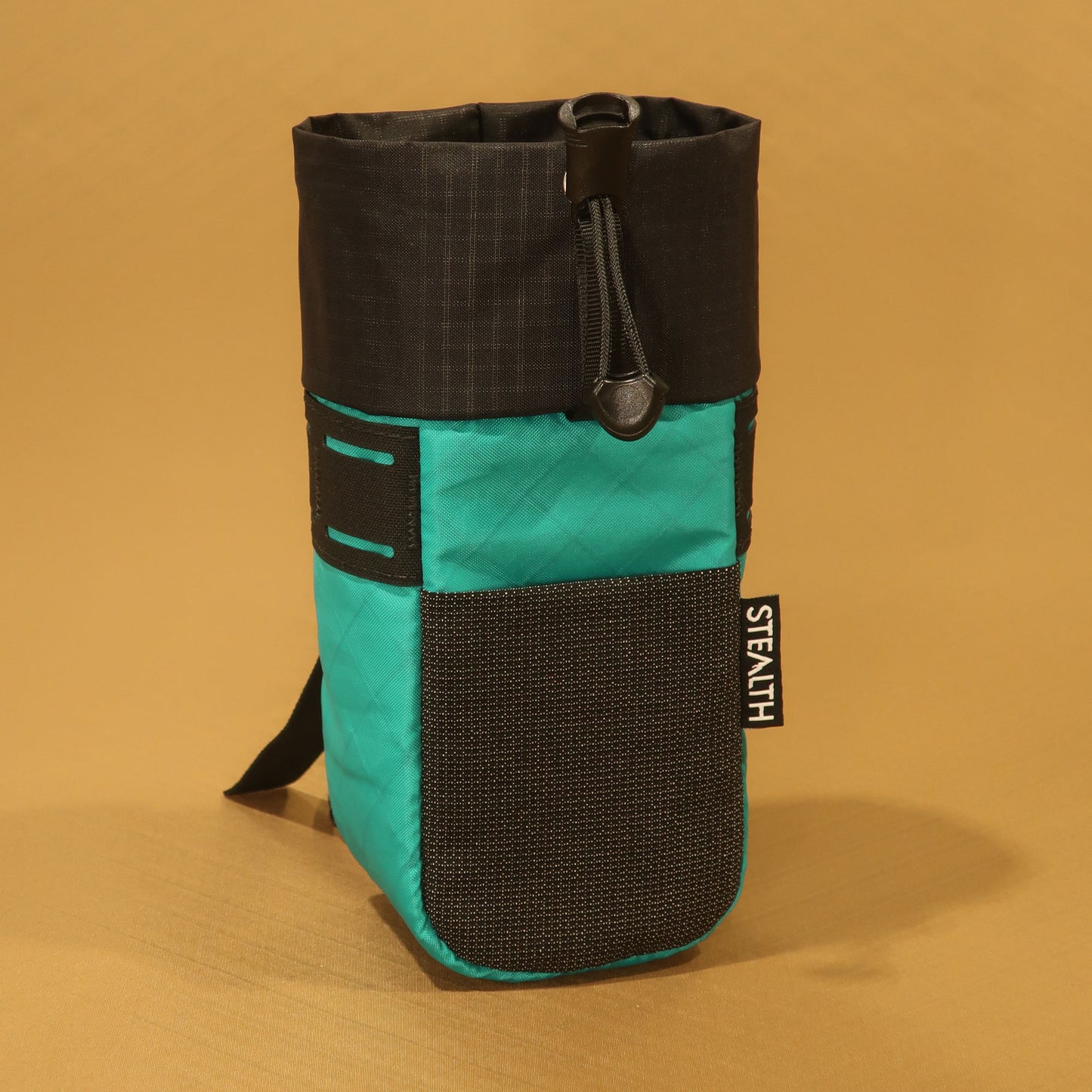 Stem Pouch V2 Teal pouch with a large front mesh pocket and webbing strap attachment points