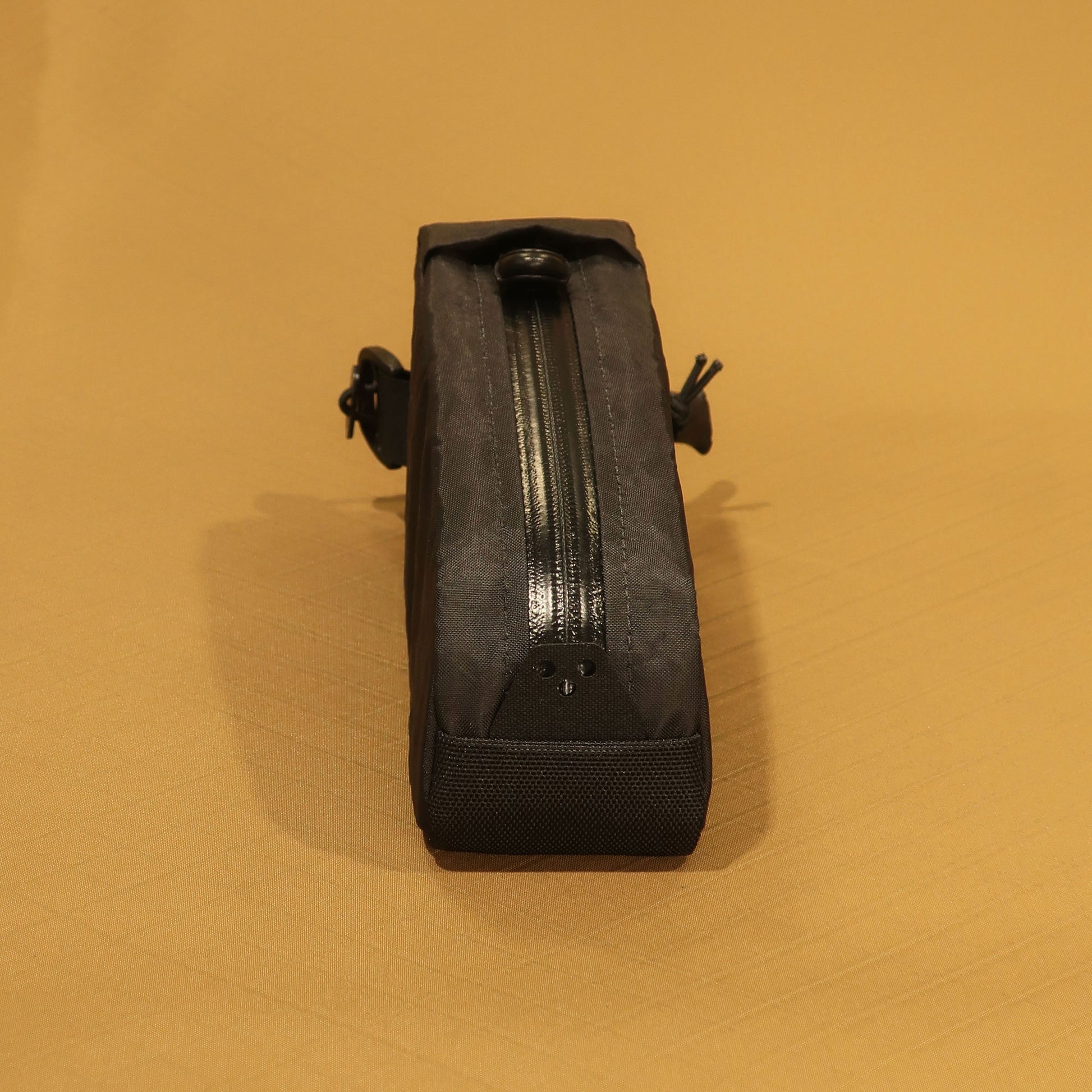 Top Loader bolt on top tube bag in black showing YKK water repellent zip and zip pull tab made by Stealth Wellington NZ