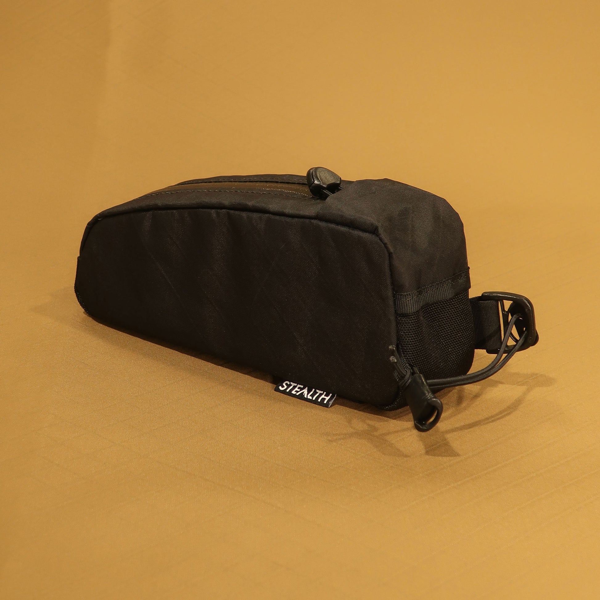 Top Loader bolt on top tube bag in black front detail with bungee attachment and cable port made by Stealth Wellington NZ