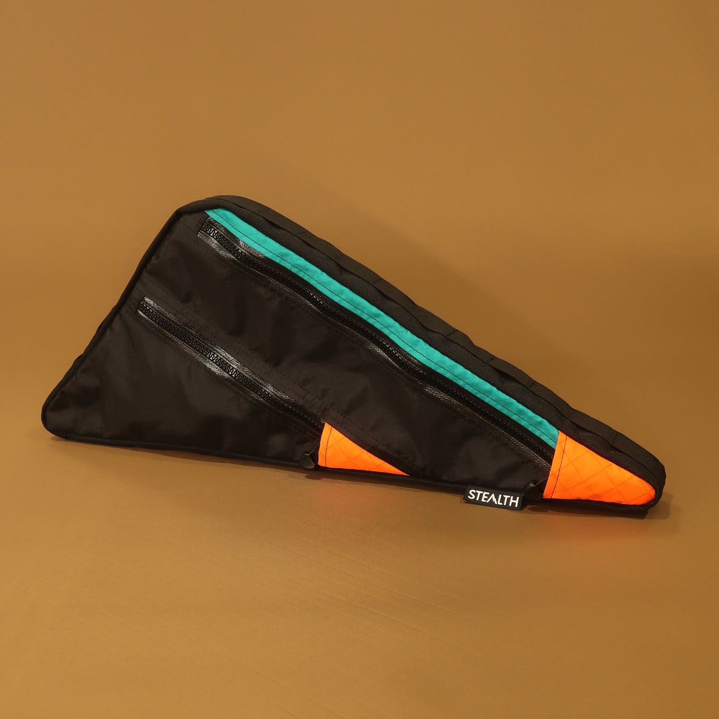 Custom full frame bag with double zip, black, teal, and orange panels, made for Trek Procaliber mountain bike, handmade in New Zealand.