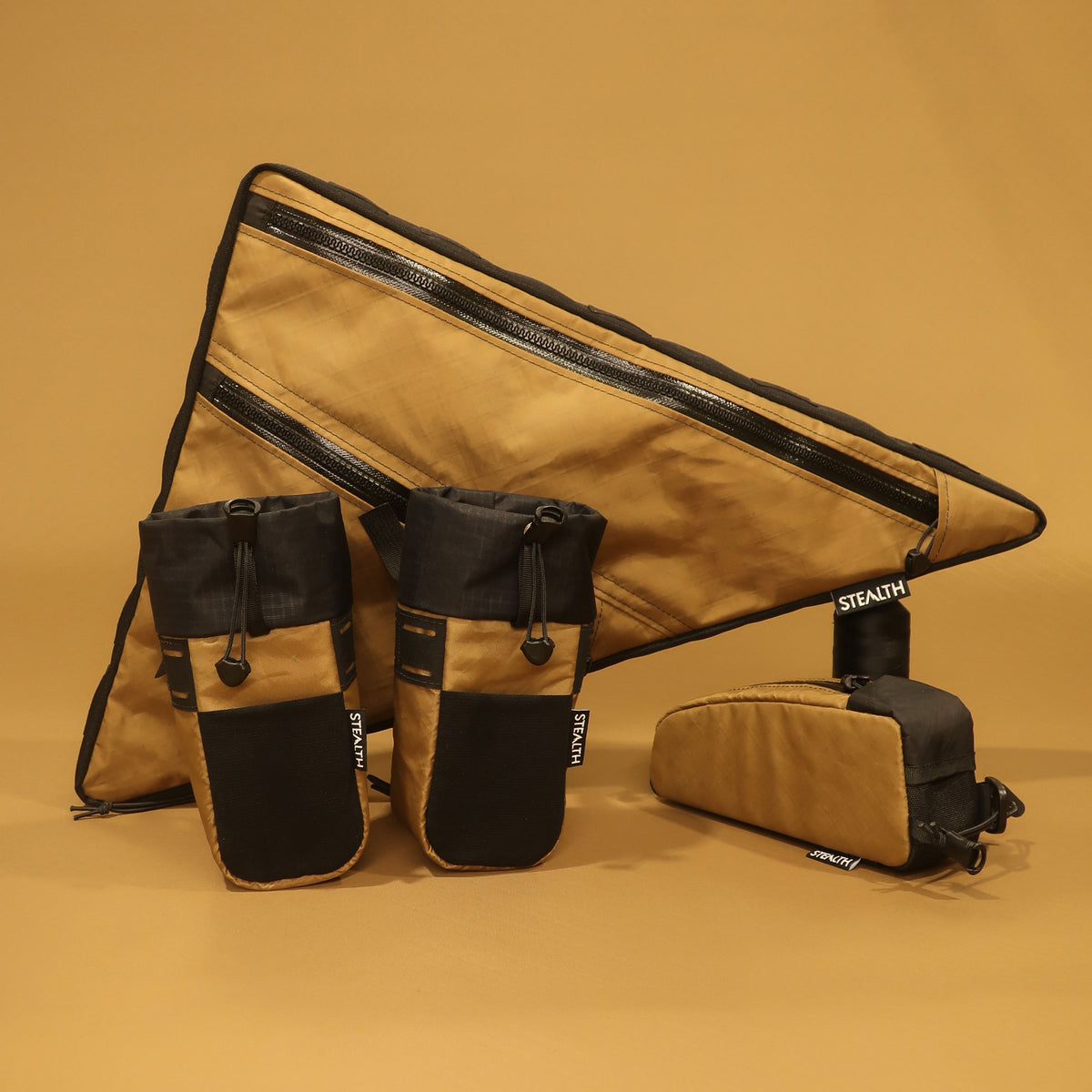 Custom full frame bag with double zips, bottle holders, and top tube bag in brown and black, handmade in New Zealand by Stealth.