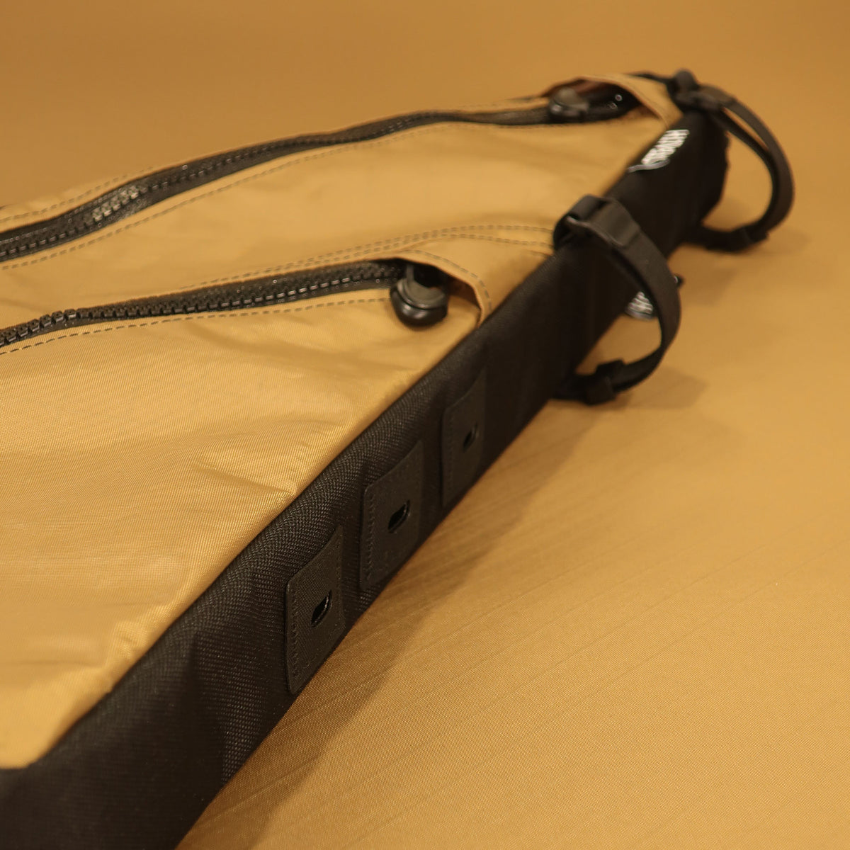 Tan and black custom full frame bag with double zippers and bolt-on attachment, designed for the Tumbleweed Prospector bike.